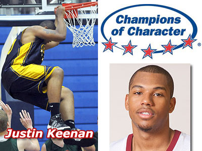 Justin Keenan hangs on the rim during last week's "Champions of Character" All-Star Game (Photo courtesy of Grand Rapids Press - www.grpress.com)